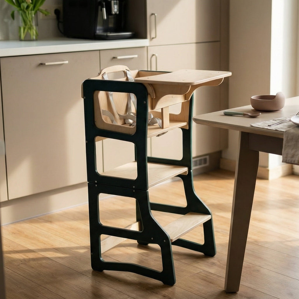 Modern kitchen with a dining table set for a meal, featuring flowers and a vase.