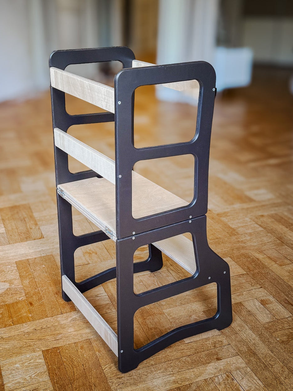 Wooden step stool on a wooden floor in a room with furniture.
